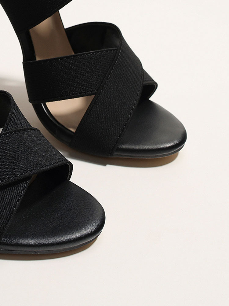 Tacones con puntera abierta y tira elástica entrecruzada