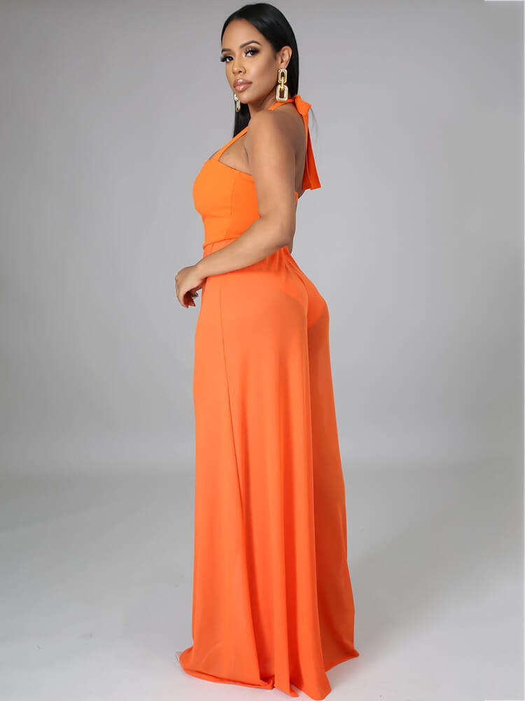 Monos de pernera ancha de malla transparente con tirantes y cuello halter