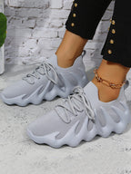 Zapatillas deportivas transpirables de punto con cordones elásticos 