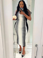 Vestido midi de canalé con cuello alto, sin mangas y borlas 