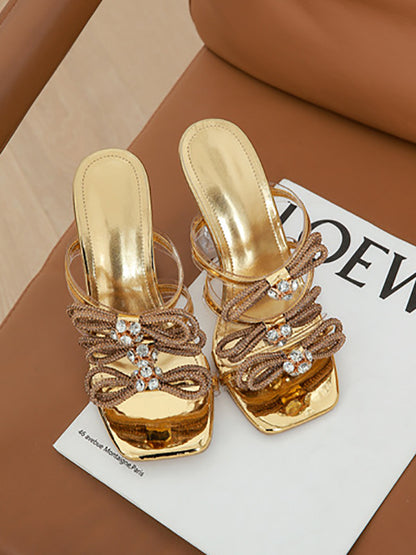 Diapositivas de tacón alto con punta cuadrada y lazo de diamantes de imitación 