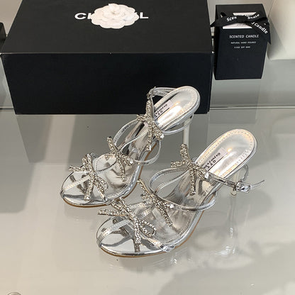 Diapositivas de tacón alto con punta cuadrada y lazo de diamantes de imitación 