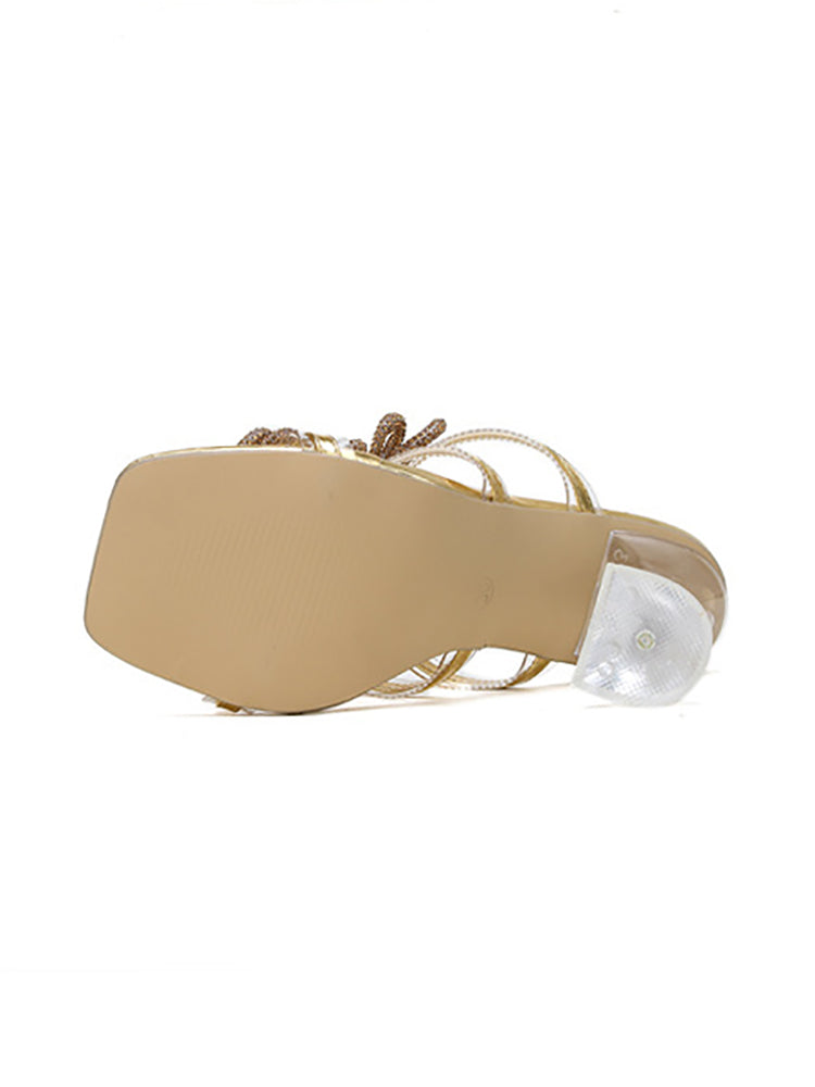 Diapositivas de tacón alto con punta cuadrada y lazo de diamantes de imitación 