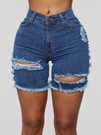 Shorts vaqueros desgastados hasta la rodilla con roturas elásticas 