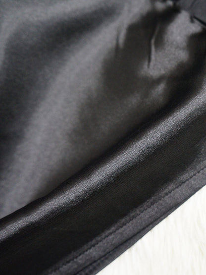 Blusa sedosa con botones y manga de murciélago holgada irregular 