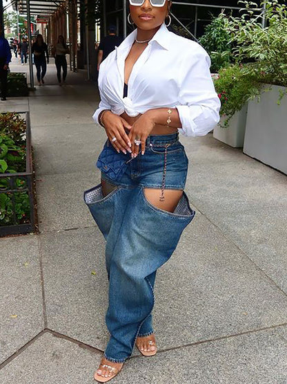 Vaqueros de mezclilla elásticos desgastados con agujeros 