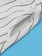 Vestido acampanado sin espalda con tiras cruzadas a rayas 