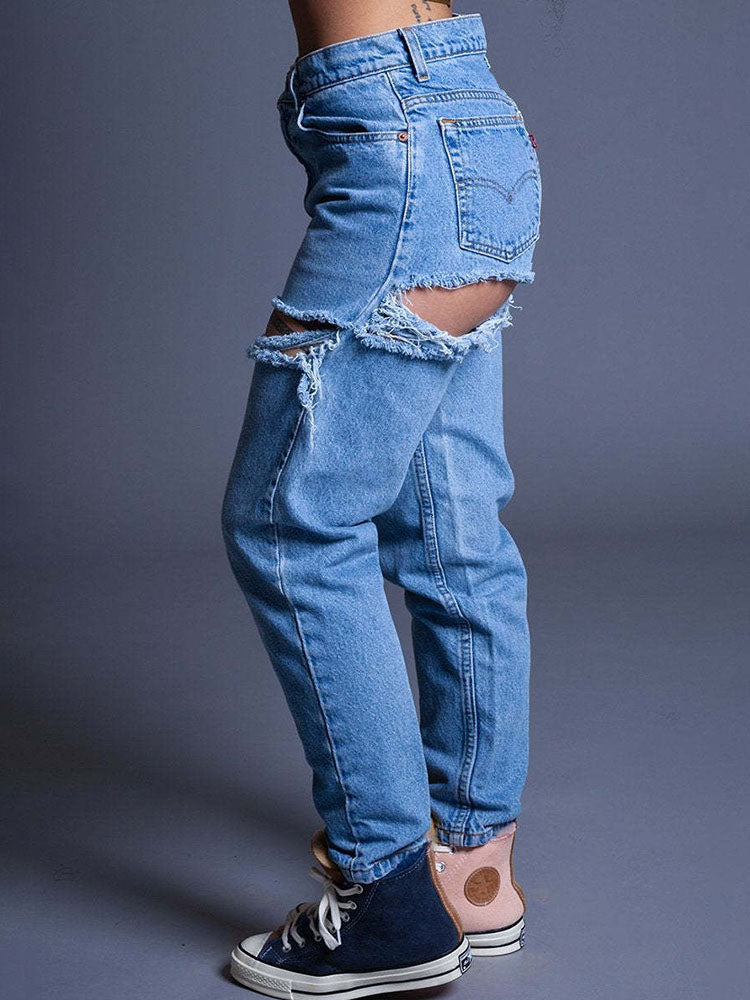 Vaqueros ajustados con cortes rasgados en denim