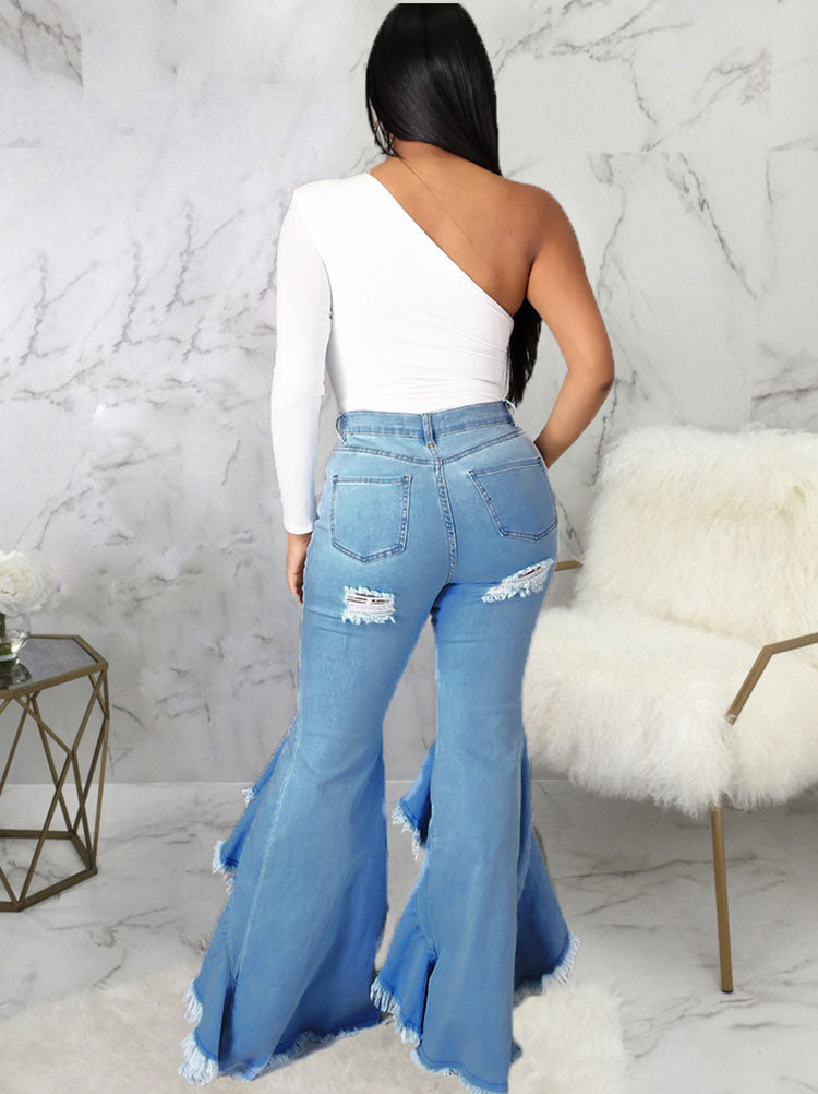 Jeans largos de mezclilla con dobladillo con volantes rasgados