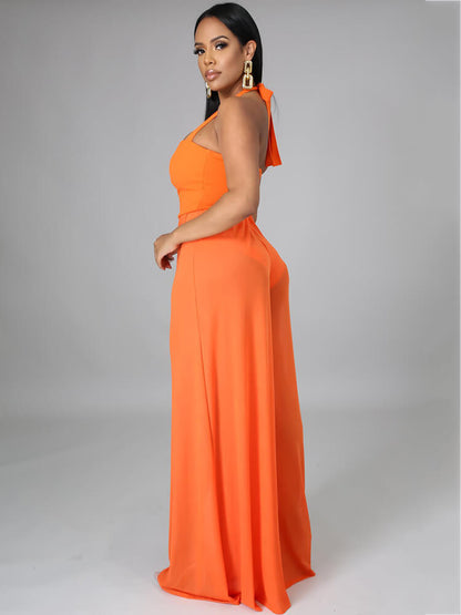 Monos de pernera ancha de malla transparente con tirantes y cuello halter 