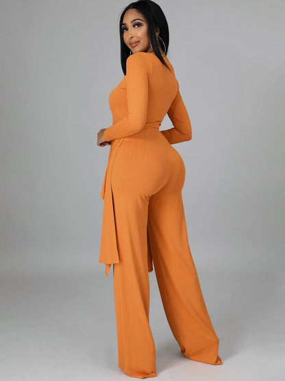 Top con cuello en V y pantalones largos con cordones irregulares de dos piezas