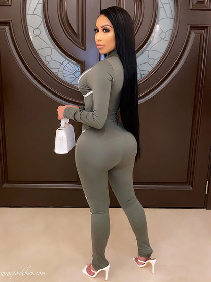 Monos ajustados con cremallera de manga larga de una pieza